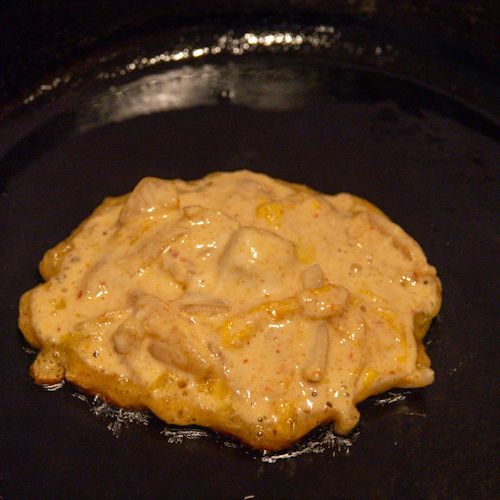 Kimchi pancakes being fried.