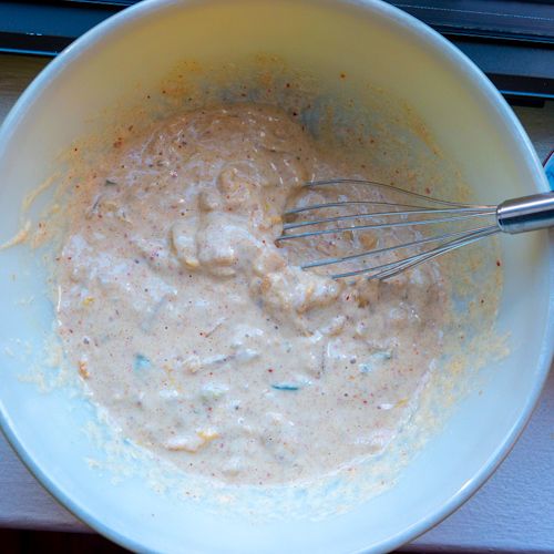 Kimchi pancake batter being mixed.